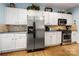Well-lit kitchen features stainless steel appliances and white cabinetry at 13216 Old Compton Ct, Pineville, NC 28134