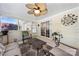 Cozy screened-in porch featuring comfortable seating and a ceiling fan at 13216 Old Compton Ct, Pineville, NC 28134