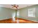This spacious bedroom features hardwood floors and sunlit windows at 1340 Piccadilly Dr, Charlotte, NC 28211