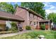 Charming brick home exterior with a cozy, screened-in porch and well-maintained walkway, great for entertaining at 1340 Piccadilly Dr, Charlotte, NC 28211