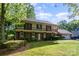 Attractive home with well-maintained lawn, mature trees, and attached two-car garage at 1340 Piccadilly Dr, Charlotte, NC 28211