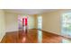 Bright living room with hardwood floors, view of staircase, and large window at 1340 Piccadilly Dr, Charlotte, NC 28211