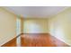 Open living room with gleaming hardwood floors and natural light at 1340 Piccadilly Dr, Charlotte, NC 28211