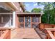Screened porch with wood flooring and beautiful view of the yard at 1340 Piccadilly Dr, Charlotte, NC 28211