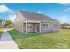 This spacious backyard features a covered patio, well-maintained lawn, and peaceful surroundings at 1352 Secrest Commons Dr, Monroe, NC 28112