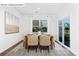 Elegant dining room with modern table, comfortable chairs, and sliding glass door at 1352 Secrest Commons Dr, Monroe, NC 28112