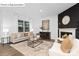 Inviting living room featuring a fireplace, comfortable seating, and lots of natural light at 1352 Secrest Commons Dr, Monroe, NC 28112