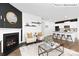 This living room seamlessly flows into the modern kitchen, creating an open and inviting space at 1352 Secrest Commons Dr, Monroe, NC 28112