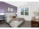 Cozy main bedroom with plush bedding, a large window, and elegant decor at 1352 Secrest Commons Dr, Monroe, NC 28112