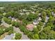 Aerial view of a neighborhood with tree-lined streets and well-maintained homes at 18305 Dembridge Dr, Davidson, NC 28036