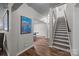 A finished basement with hardwood floors, a staircase, and a recreational space at 18305 Dembridge Dr, Davidson, NC 28036