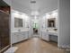 Large bathroom with double sinks, walk-in shower and decorative mirrors at 18305 Dembridge Dr, Davidson, NC 28036