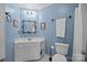 Cozy bathroom with vanity, decorative mirror, and towel bar at 18305 Dembridge Dr, Davidson, NC 28036