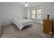 Neutral bedroom with natural light, ceiling fan, and carpet floors at 18305 Dembridge Dr, Davidson, NC 28036