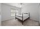 Bright bedroom with a ceiling fan, and a large window with natural light at 18305 Dembridge Dr, Davidson, NC 28036
