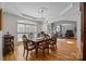 Elegant dining room with hardwood floors, crown molding, and a chandelier at 18305 Dembridge Dr, Davidson, NC 28036