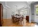 Formal dining room with hardwood floors, a decorative chandelier and large window at 18305 Dembridge Dr, Davidson, NC 28036