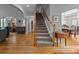 Inviting foyer with hardwood floors, staircase, and views into other living spaces at 18305 Dembridge Dr, Davidson, NC 28036