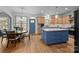 Eat-in kitchen with granite countertops, an island, and stainless steel appliances at 18305 Dembridge Dr, Davidson, NC 28036