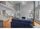 Open-concept living area with high ceilings, a fireplace, and hardwood floors at 18305 Dembridge Dr, Davidson, NC 28036