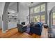 Bright living room featuring built-in shelves, a fireplace, and large windows at 18305 Dembridge Dr, Davidson, NC 28036
