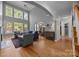 Spacious living room with lots of natural light and hardwood flooring at 18305 Dembridge Dr, Davidson, NC 28036