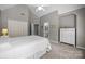 Bright main bedroom with a ceiling fan, ensuite bathroom and spacious closet at 18305 Dembridge Dr, Davidson, NC 28036