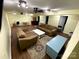 Spacious basement featuring wood floors, comfortable couches, and lots of lighting at 201 Mitchell St, Belmont, NC 28012