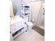 Bathroom with a white vanity, tiled floors, and a shower with a curtain at 201 Mitchell St, Belmont, NC 28012