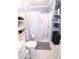 Clean bathroom with a shower stall, storage shelves, and blue accents at 201 Mitchell St, Belmont, NC 28012