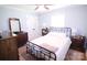 Charming bedroom with vintage furniture, a metal bed frame, and ample natural light at 201 Mitchell St, Belmont, NC 28012