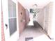 Exterior shot of a walkway leading to the back of the house between a brick and vinyl wall at 201 Mitchell St, Belmont, NC 28012
