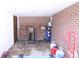 Covered exterior space with brick wall, storage, and a door at 201 Mitchell St, Belmont, NC 28012