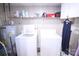 Practical laundry area with a washer, dryer, utility sink and shelving for storage at 201 Mitchell St, Belmont, NC 28012