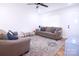 Cozy living room with a vintage rug, sofas, and natural light at 201 Mitchell St, Belmont, NC 28012