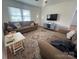Comfortable living room with hardwood floors, natural light, and comfortable seating at 201 Mitchell St, Belmont, NC 28012