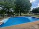 In-ground pool with diving board, ladders and fenced yard for safety at 201 Mitchell St, Belmont, NC 28012
