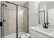 Modern bathroom with glass-enclosed shower, sleek vanity, and neutral tile work creates a spa-like retreat at 2020 Embassy Ct # 48, Charlotte, NC 28213