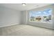 Carpeted bedroom with three pane window providing lots of natural light at 2020 Embassy Ct # 48, Charlotte, NC 28213