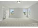 Inviting bedroom with carpet and multiple windows providing views of neighborhood at 2020 Embassy Ct # 48, Charlotte, NC 28213