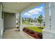 View from the covered porch shows the green landscaped neighborhood at 2020 Embassy Ct # 48, Charlotte, NC 28213