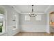 Dining room with natural light, wood flooring, and decorative molding at 2020 Embassy Ct # 48, Charlotte, NC 28213
