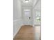 Bright foyer with decorative molding, front door, and wood flooring at 2020 Embassy Ct # 48, Charlotte, NC 28213