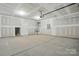 Spacious unfinished garage with ample room for parking and storage, offering versatility and potential at 2020 Embassy Ct # 48, Charlotte, NC 28213