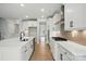 Kitchen featuring white cabinets, stainless appliances, and large island at 2020 Embassy Ct # 48, Charlotte, NC 28213