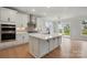 Kitchen with white cabinets, stainless steel appliances, and a large island with seating at 2020 Embassy Ct # 48, Charlotte, NC 28213