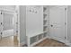 Bright mudroom featuring built-in storage, hooks, and seating, creating an organized entry point at 2020 Embassy Ct # 48, Charlotte, NC 28213
