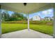 Covered patio offering views of the grassy backyard and the neighbor's home at 2020 Embassy Ct # 48, Charlotte, NC 28213