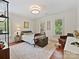 Cozy bedroom featuring hardwood floors, neutral walls, two windows, and a vintage-style bed at 2417 Calais Pl, Charlotte, NC 28211