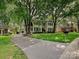 A traditional two-story home with a well-manicured lawn and mature trees at 2417 Calais Pl, Charlotte, NC 28211